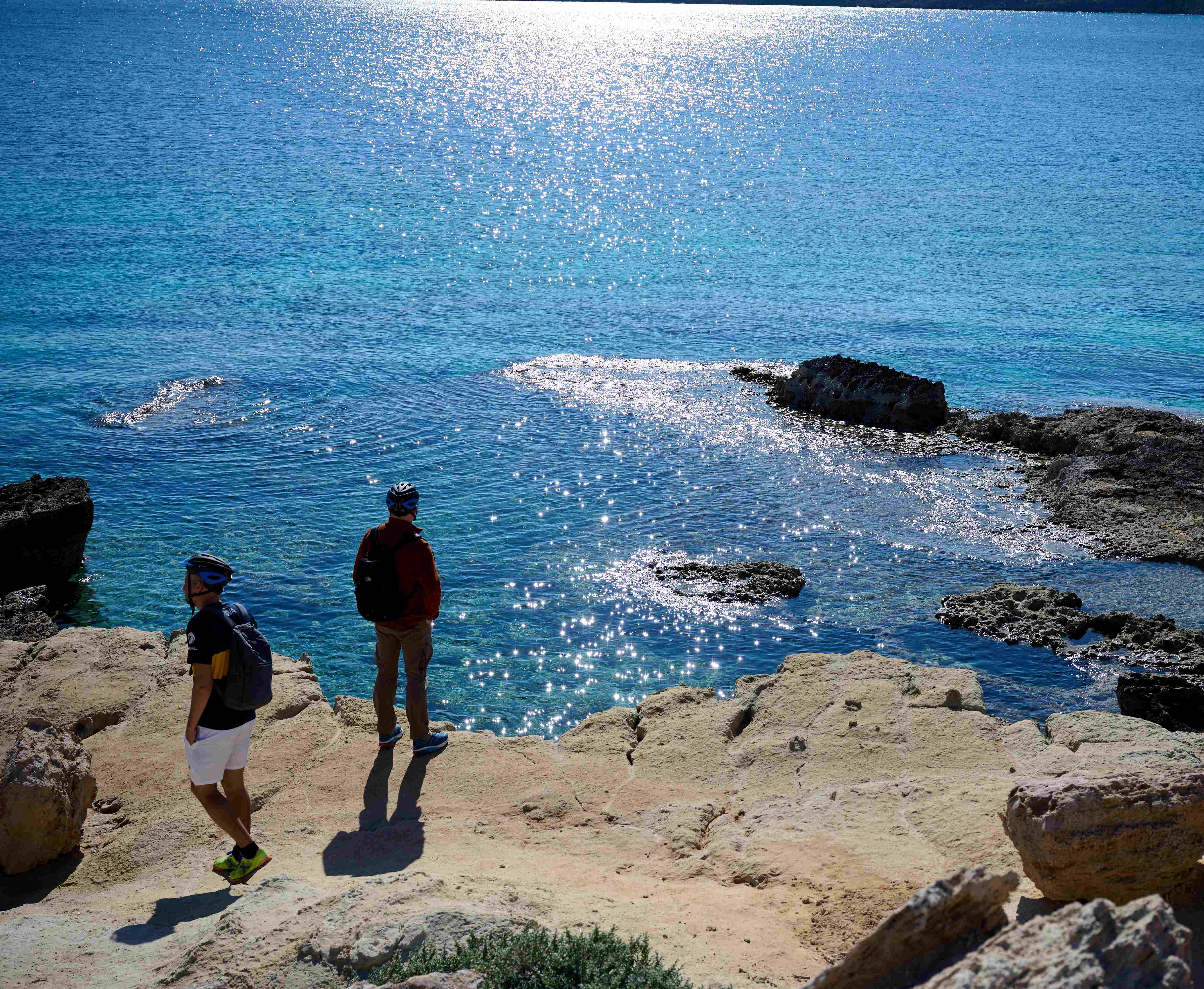 Hikers overlooking the sea near Cape Greco