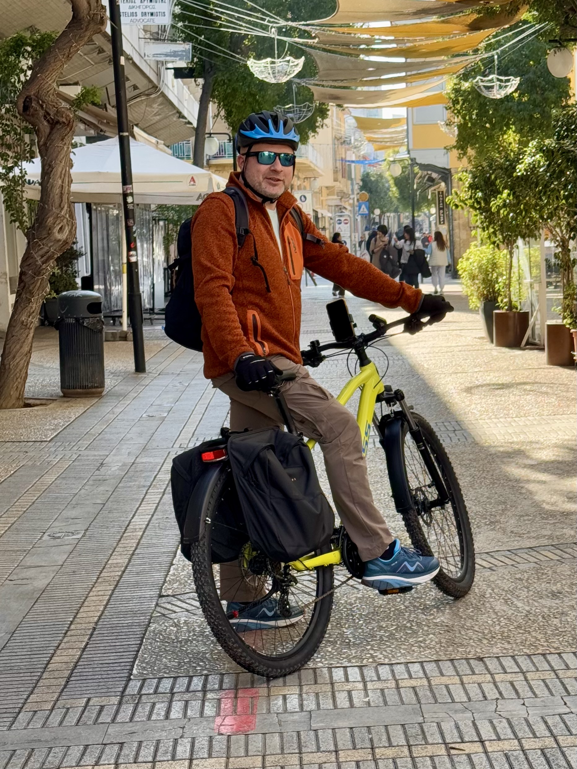 Cyclist riding through colorful, shaded Ledra Street in Nicosia